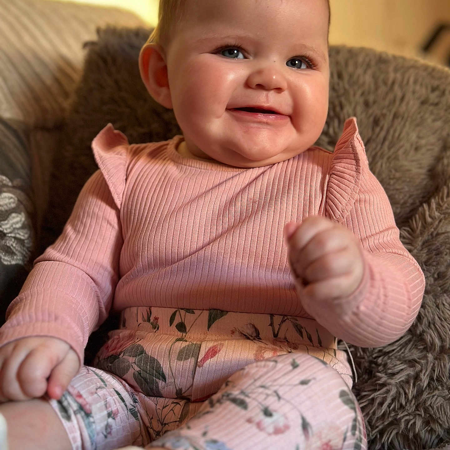 Olivia is registered to the contest to win money with this photo: baby, babylaughing, bodypart, clothing, couch, cushion, face, finger, furniture, hand, happy, head, homedecor, hosiery, person, photography, portrait, sitting, smile, sock