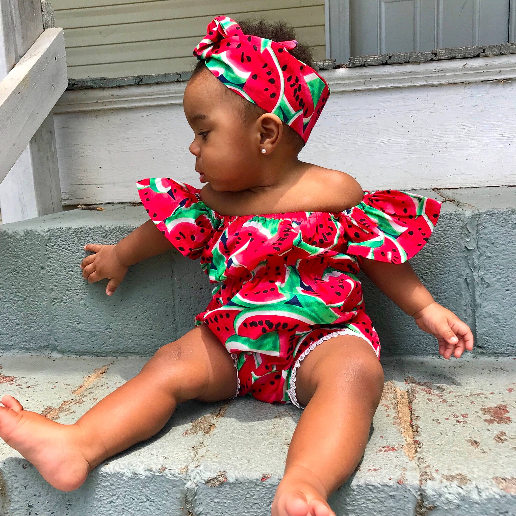 Bri is registered to the contest to win money with this photo: baby, baby_bloomers, baby_toddler_clothing, barefoot, child, clothing, fashion_accessory, hair_accessory, headband, headgear, pattern, person, play, sitting, toddler