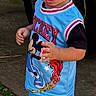 toddler, child, boy, standing, outdoor, clothing, basketball, mickey_mouse, sneakers, shoes, curly_hair, vehicle_tire, sidewalk, grass, casual, shorts, tank_top, street, daylight, person