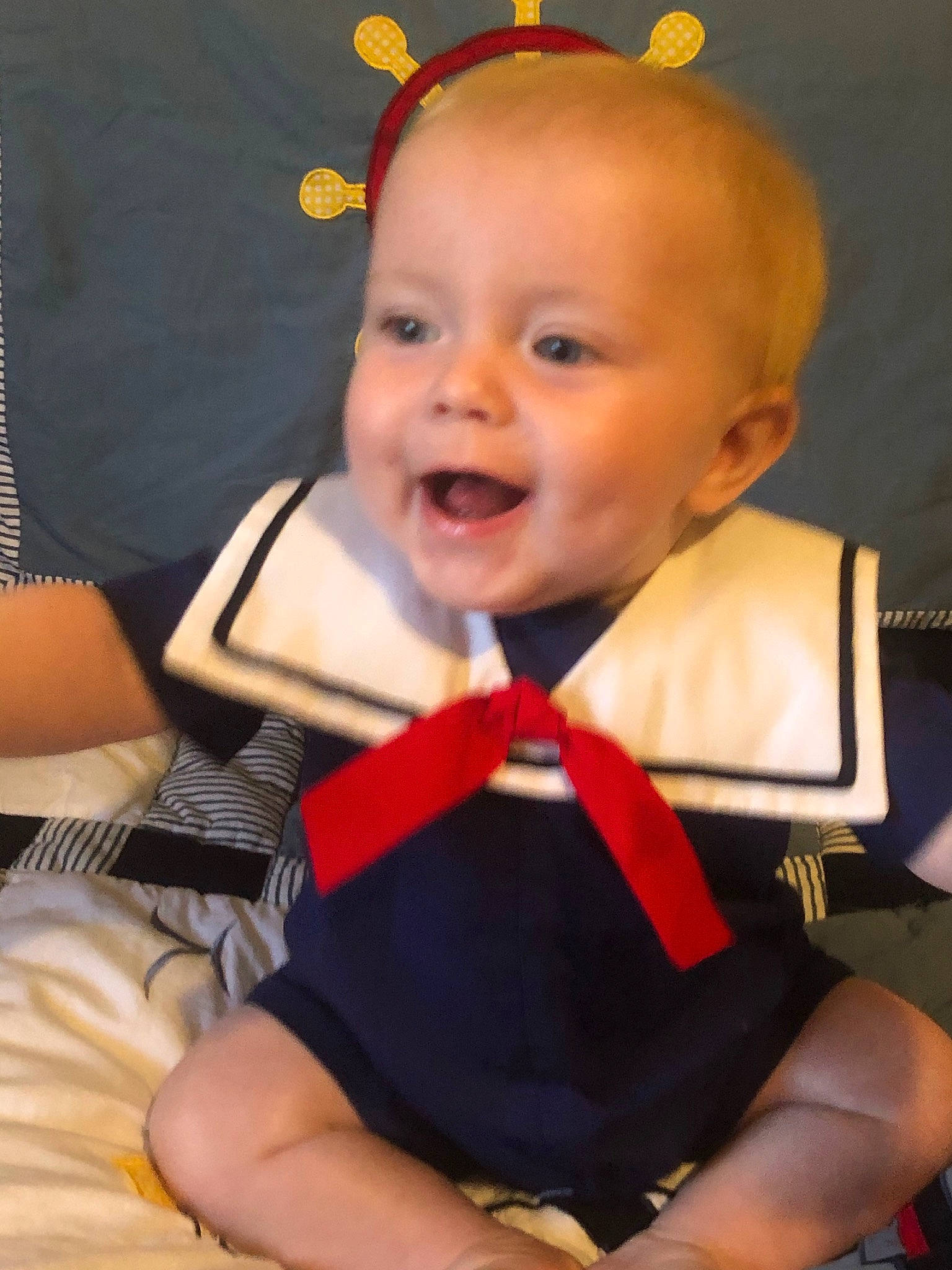 Bennett is registered to the contest to win money with this photo: arm, baby, baby_carriage, baby_products, baby_toddler_clothing, cheek, child, chin, ear, facial_expression, finger, head, leg, person, product, sitting, skin, smile, toddler