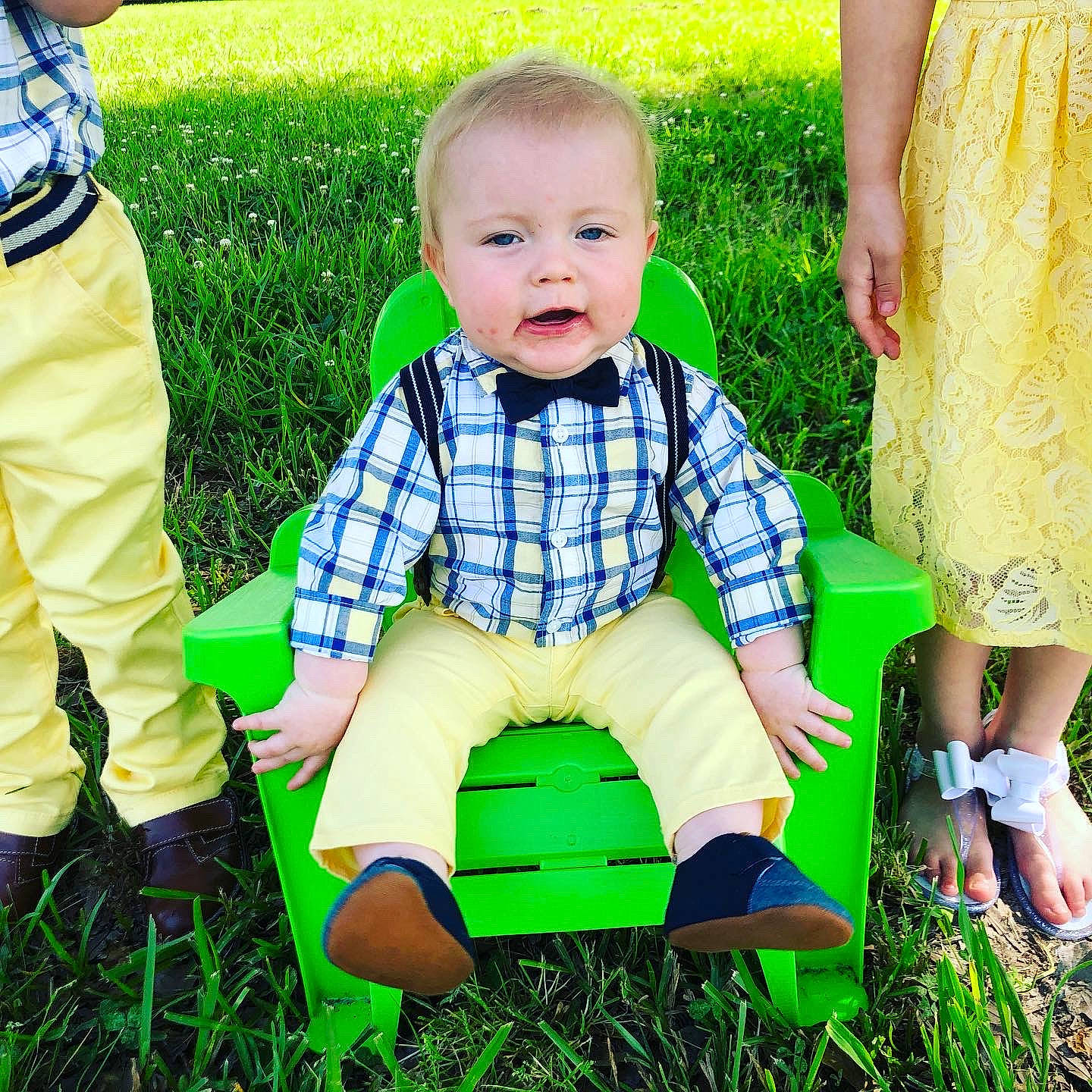 Bennett is registered to the contest to win money with this photo: baby, baby_toddler_clothing, child, design, grass, green, lawn, leg, outerwear, pattern, people_in_nature, person, plaid, play, playing_with_kids, sitting, spring, summer, toddler, yellow