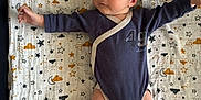 Lilyo participe au concours pour gagner de l'argent avec cette photo : arm, baby, blanket, child, clouds, comfort, cute, fabric, face, head, indoors, infant, leg, lying_down, newborn, onesie, pacifier, pattern, sleepwear, stars