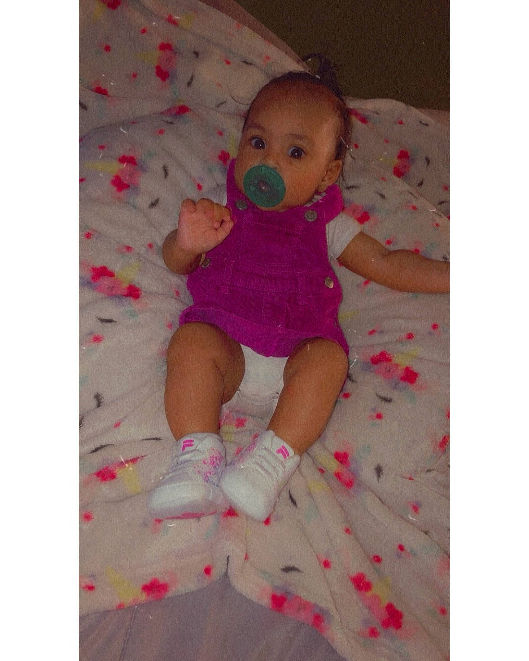 Royalty is registered to the contest to win money with this photo: arm, baby, baby_safety, baby_toddler_clothing, comfort, finger, foot, hand, happy, infant_bodysuit, linens, magenta, pattern, person, pink, product, sleeve, textile, thigh, thumb