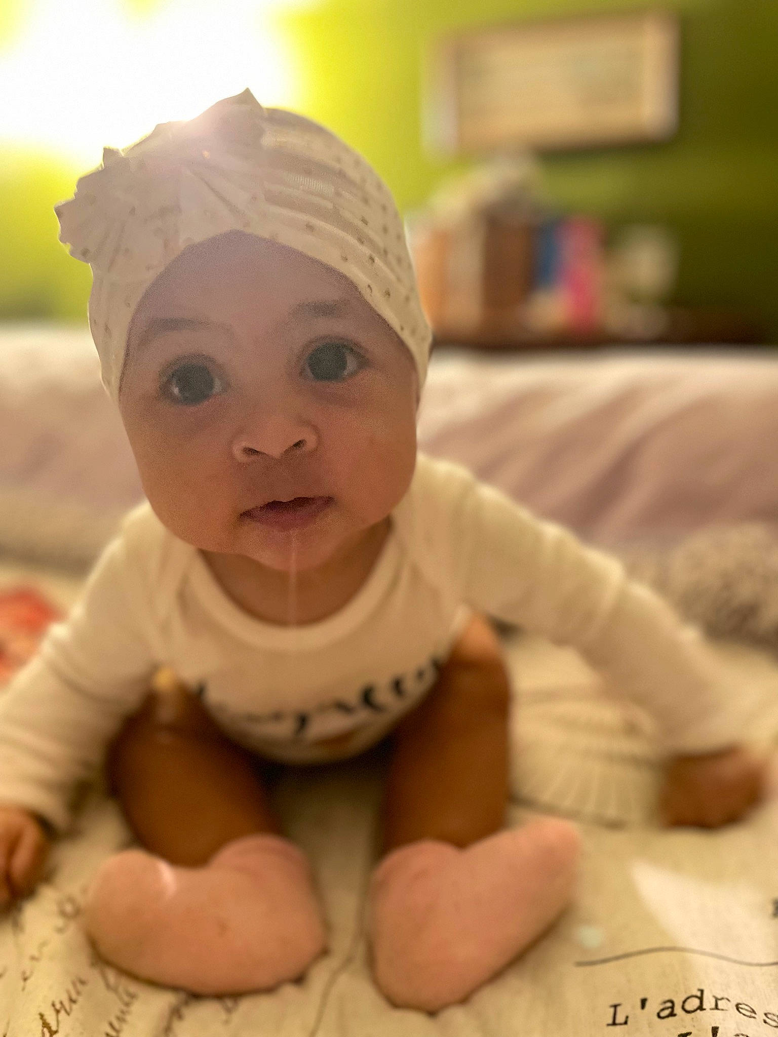 Royalty is registered to the contest to win money with this photo: baby, baby_products, baby_toddler_clothing, cheek, chin, comfort, eye, eyebrow, flooring, happy, head, headgear, headwear, mouth, nose, person, skin, sleeve, thumb, toddler