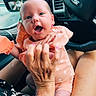adult, baby, car_interior, casual, child, clothing, ford_logo, hands, happy, holding, infant, mirror, person, seat, skin, smiling, steering_wheel, transport, vehicle, window