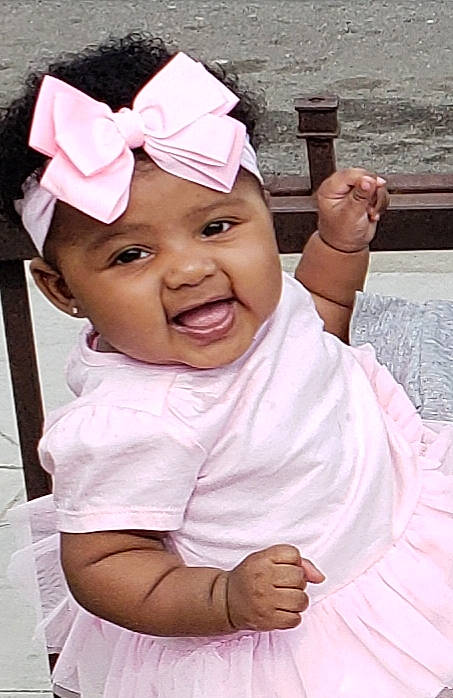 Arayah is registered to the contest to win money with this photo: baby, child, facial_expression, hair_accessory, happy, headband, headgear, headwear, person, pink, smile, toddler