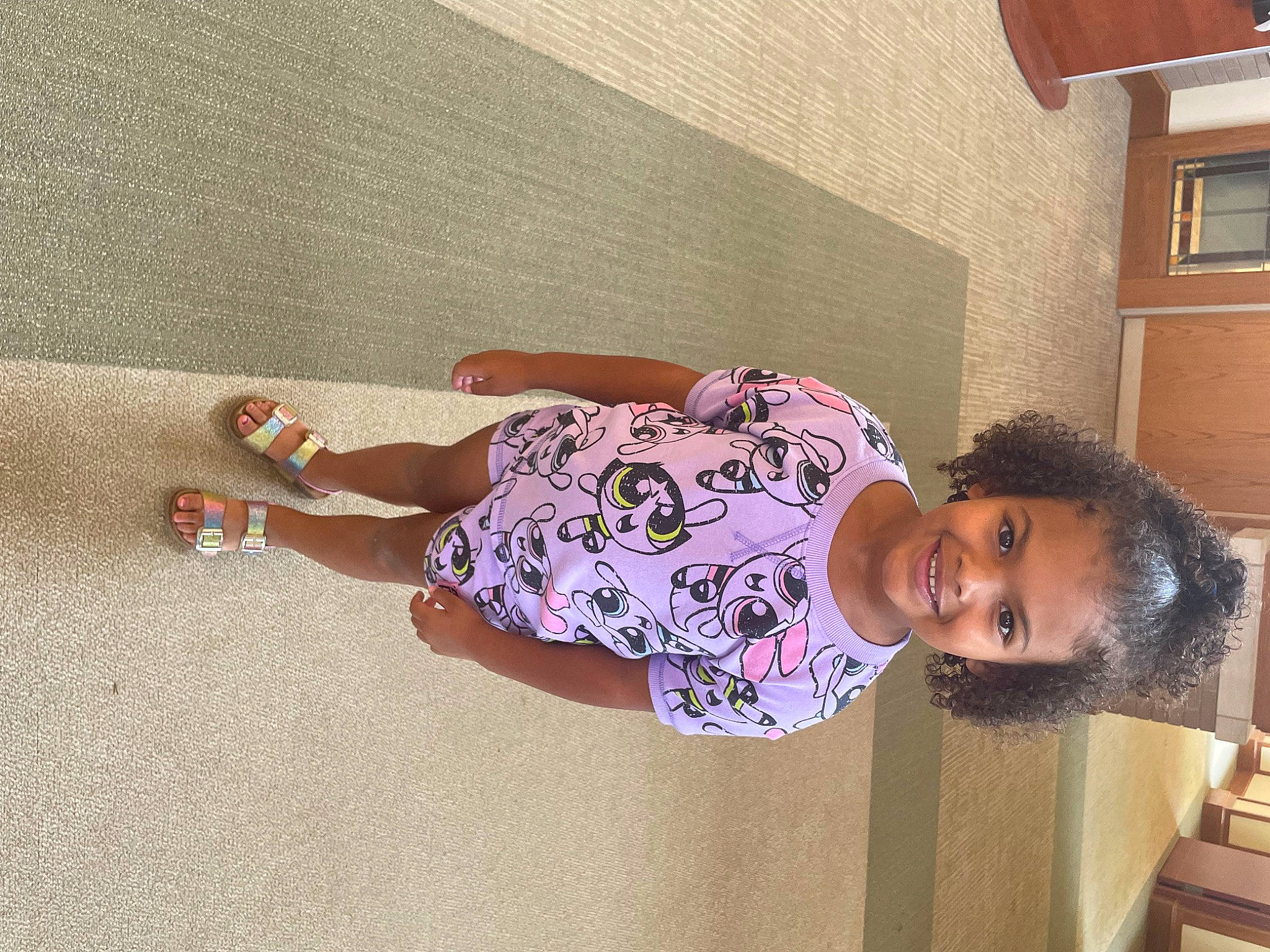 Hayden is registered to the contest to win money with this photo: child, flooring, fun, happy, human_leg, joy, knee, leisure, magenta, pattern, person, room, sandal, sleeve, smile, thigh, toddler