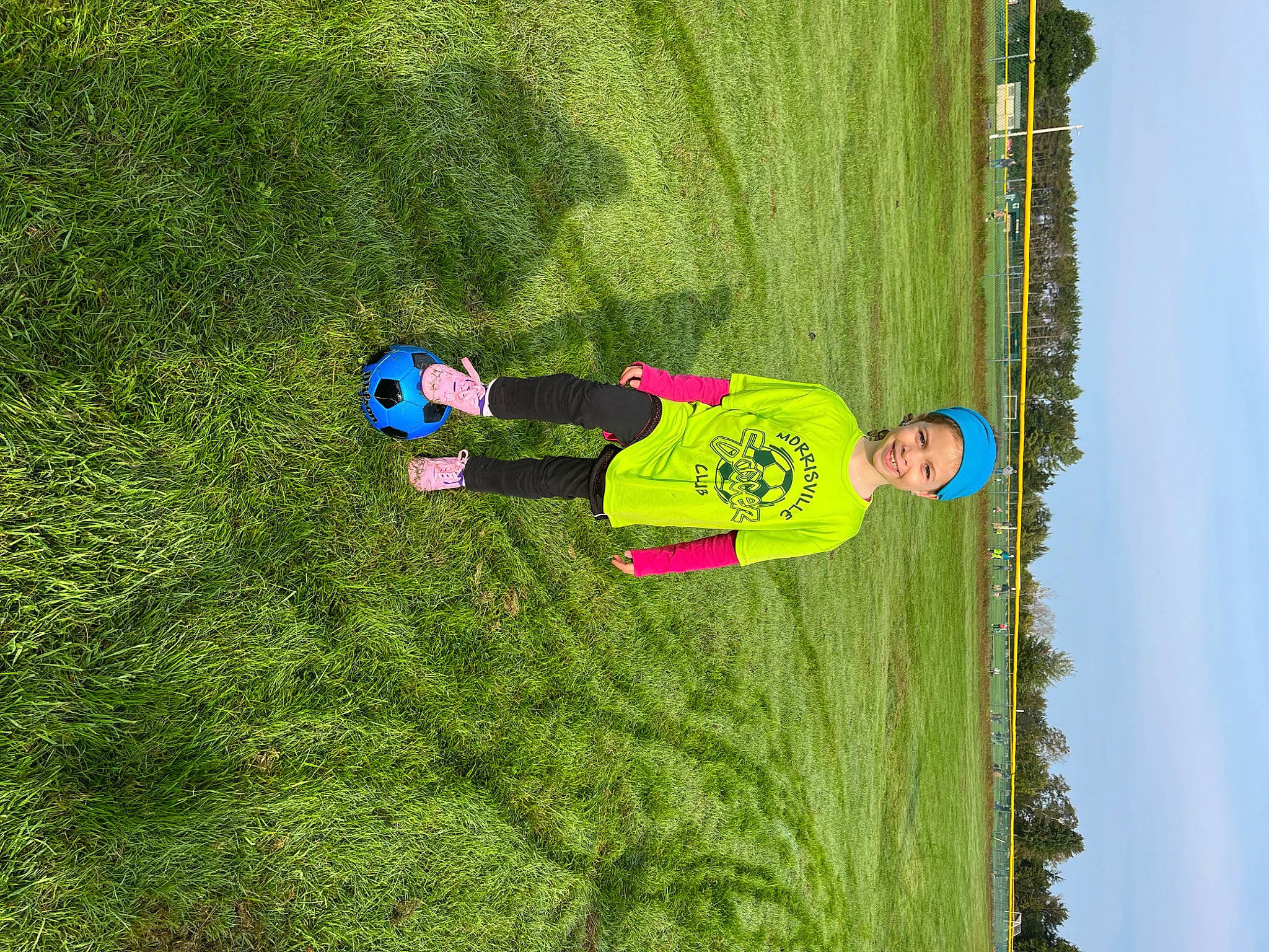 Evelyn joined the competition — help win amazing prizes! artificial_turf, ball, flooring, fun, grass, grassland, green, groundcover, joy, landscape, lawn, leisure, people_in_nature, person, plant, play, recreation, shrub, sky, slope