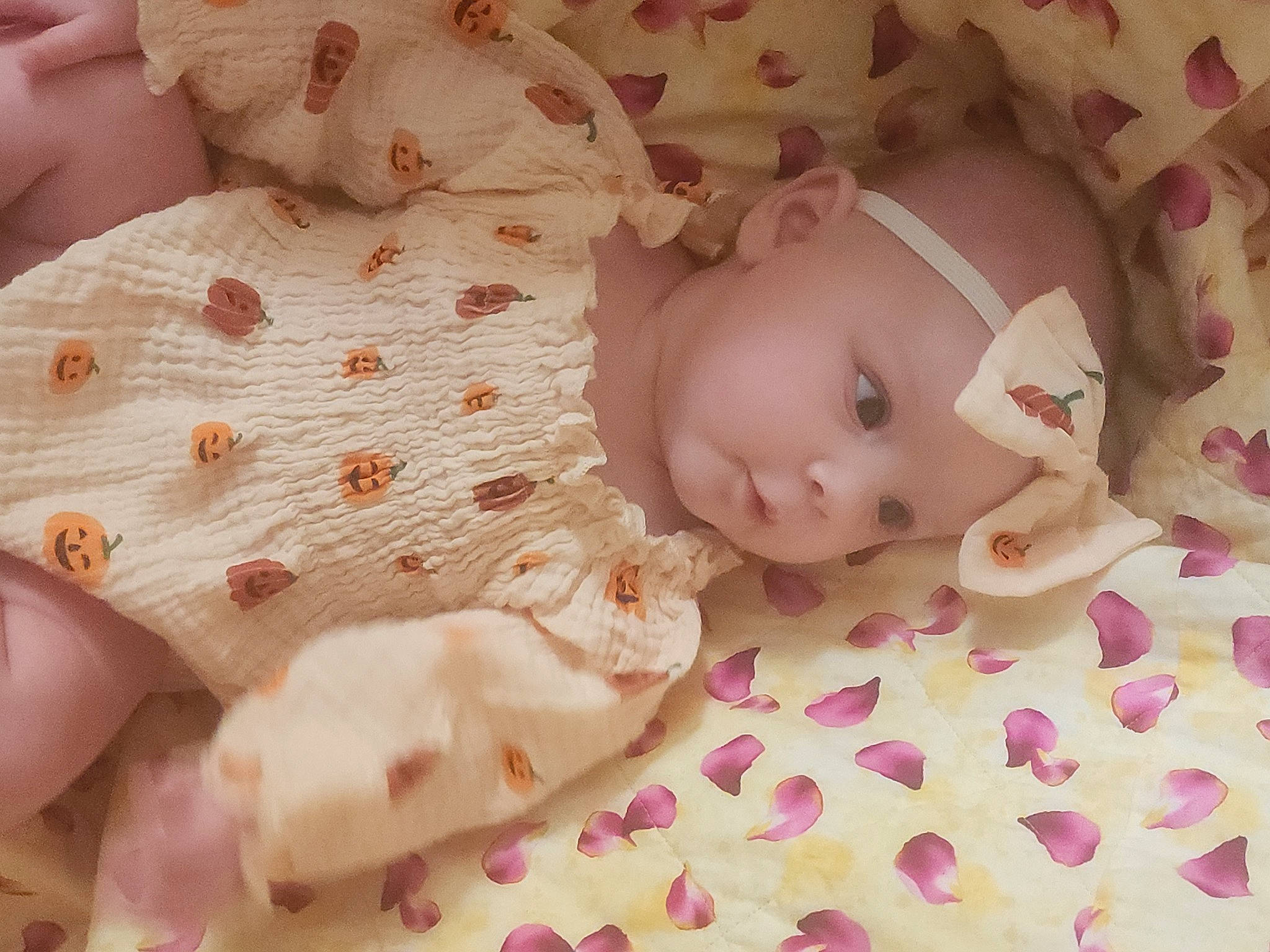 Stormi is registered to the contest to win money with this photo: baby, baby_toddler_clothing, cheek, child, comfort, doll, eye, eyelash, fawn, head, headwear, human_body, linens, mammal, pattern, peach, person, pink, skin, sweetness