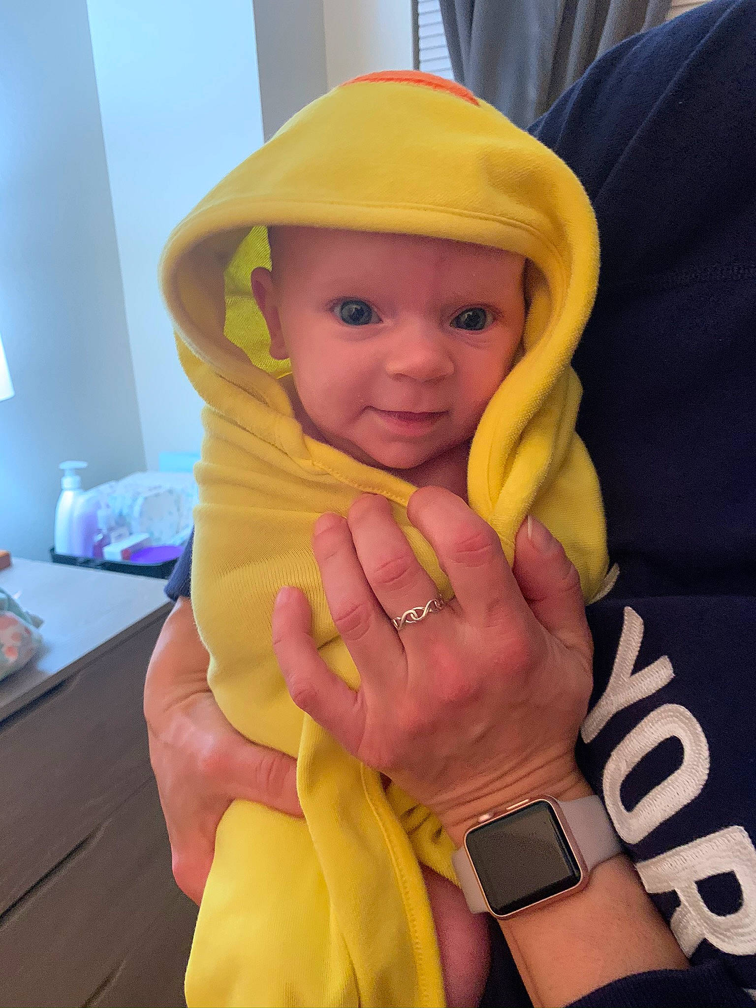 Annaleah is registered to the contest to win money with this photo: baby, child, costume, finger, hand, head, headgear, headwear, outerwear, person, skin, thumb, toddler, vacation, yellow