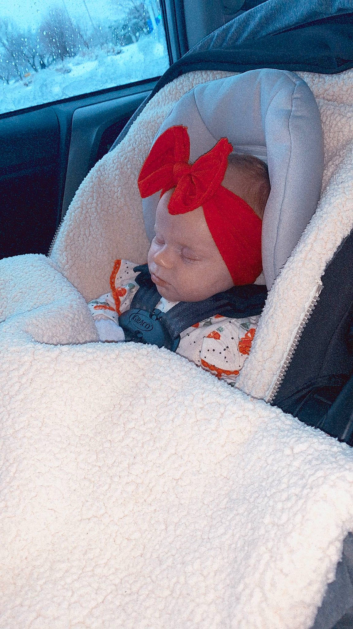 Annaleah is registered to the contest to win money with this photo: auto_part, baby, car, car_seat, child, comfort, headwear, linens, nap, person, red, sleep, textile, vacation, vehicle