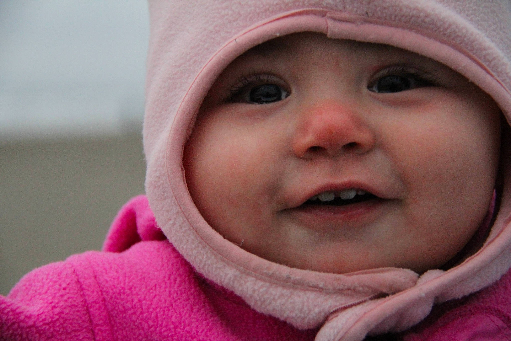 Jenna is registered to the contest to win money with this photo: cheek, child, chin, close_up, eye, face, girl, head, headwear, infant, laughter, lip, mouth, nose, person, pink, portrait_photography, skin, smile, toddler