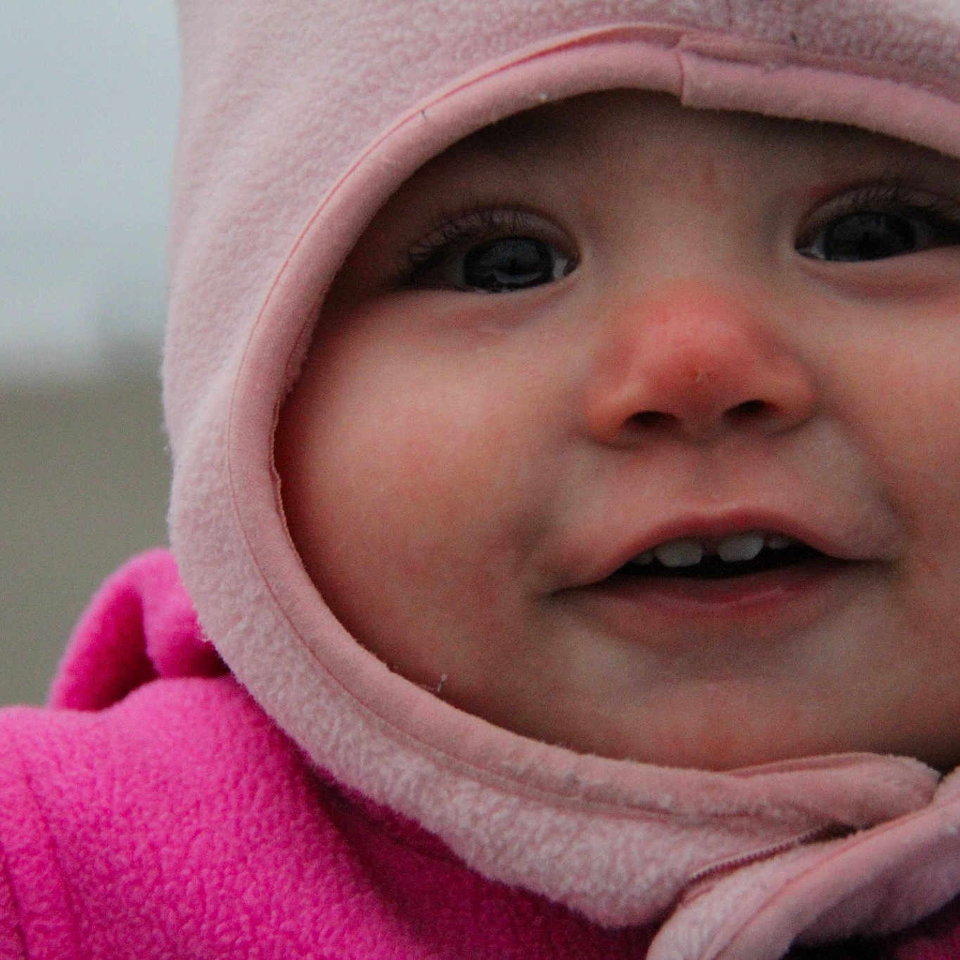 Jenna is registered to the contest to win money with this photo: cheek, child, chin, close_up, eye, face, girl, head, headwear, infant, laughter, lip, mouth, nose, person, pink, portrait_photography, skin, smile, toddler