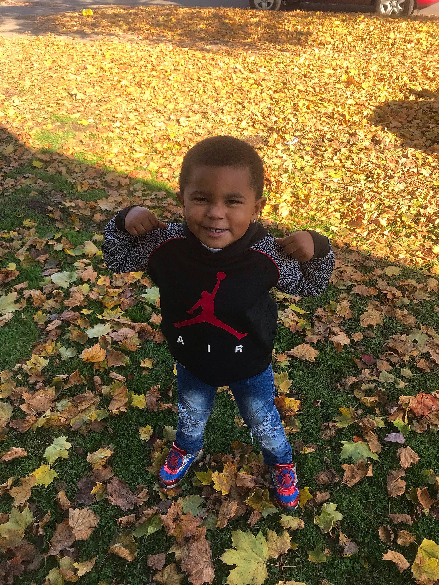 Xavier is registered to the contest to win money with this photo: adaptation, baby, baby_toddler_clothing, deciduous, flooring, grass, happy, joy, landscape, leaf, leg, nature, people_in_nature, person, plant, smile, soil, tints_and_shades, toddler, tree