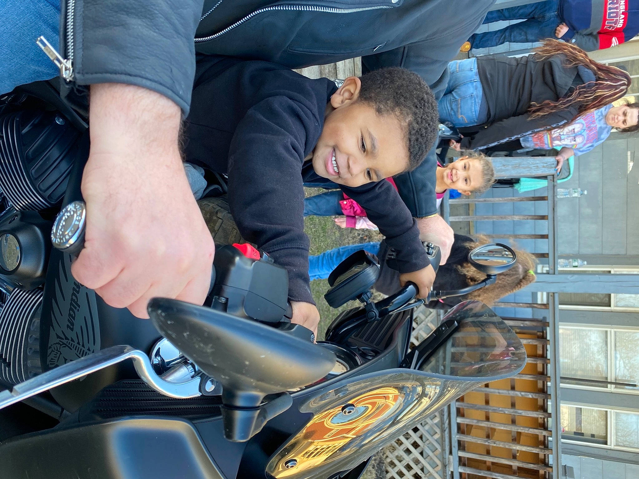 Xavier is registered to the contest to win money with this photo: arm, auto_part, automotive_design, automotive_exterior, automotive_lighting, automotive_tire, bicycle_handlebar, bicycle_saddle, child, family_car, headlamp, joy, motor_vehicle, people, person, personal_protective_equipment, recreation, sneakers, sorrow, toddler