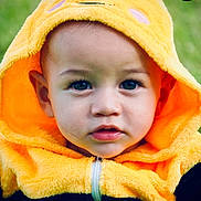 Judah joined the competition — help win amazing prizes! child, toddler, costume, bee_costume, hood, yellow, black, face, portrait, cute, outdoor, green_background, eyes, expression, baby, zipper, soft_texture, clothing, animal_theme, antennae