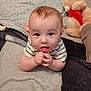 baby, blanket, carpet, child, comfort, cozy, curious, cute, expression, face, hands, indoor, infant, lying_down, portrait, soft_toy, striped_shirt, teddy_bear, toy, young