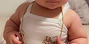 Sonia joined the competition — help win amazing prizes! adorable, baby, bed, child, chubby_arms, closeup, curly_hair, cute, cute_expression, denim, gold_chain, indoor, infant, jewelry, person, portrait, sitting, tank_top, white_clothing, young_child