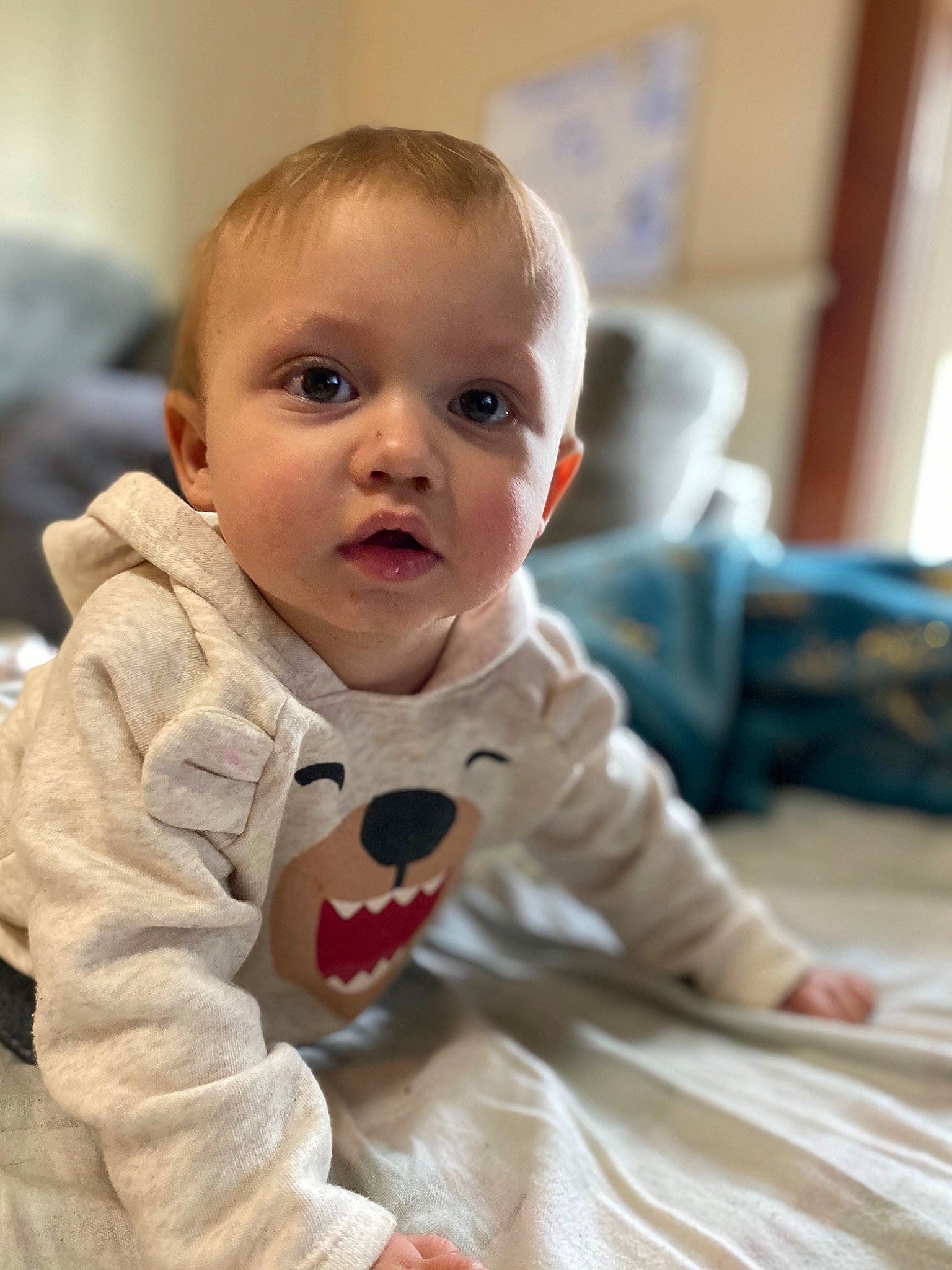 Radley is registered to the contest to win money with this photo: baby, cheek, child, eye, face, facial_expression, head, mouth, nose, person, sitting, skin, smile, toddler, tummy_time