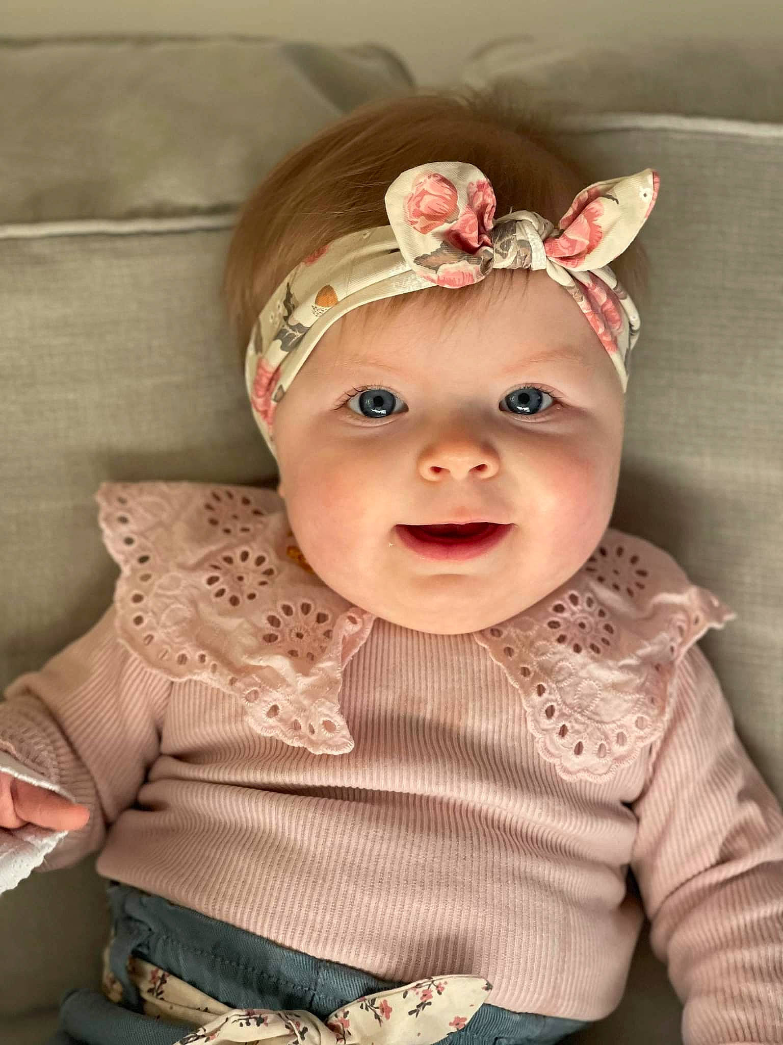 Elya participe au concours pour gagner de l'argent avec cette photo : baby, baby_toddler_clothing, cap, cheek, child, chin, dress, eye, happy, headgear, headpiece, headwear, helmet, human_body, iris, lip, person, pink, skin, sleeve