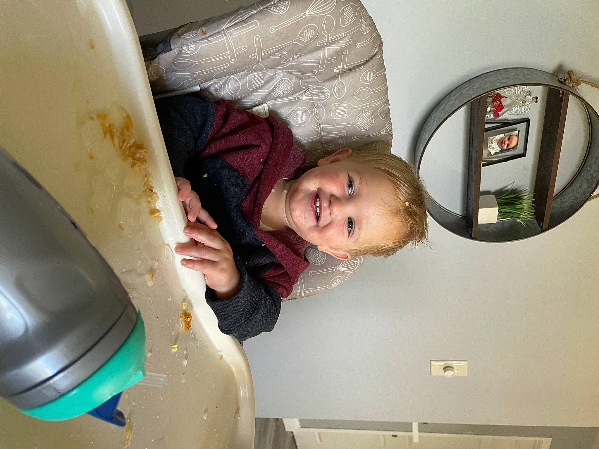 Holden is registered to the contest to win money with this photo: auto_part, automotive_exterior, automotive_lighting, baby, circle, fender, fun, gas, headgear, hood, joy, machine, mirror, motor_vehicle, oval, person, personal_protective_equipment, picture_frame, room, smile