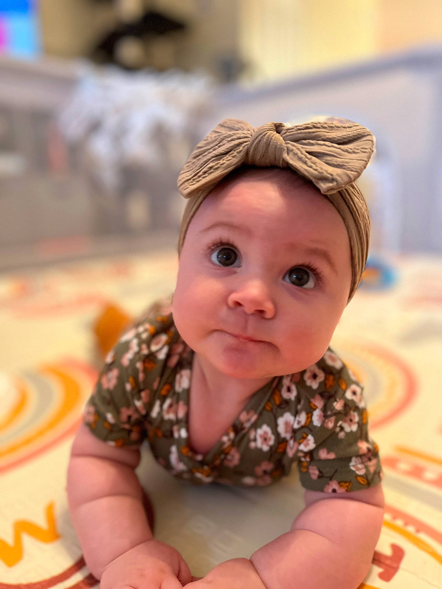 Finnley is registered to the contest to win money with this photo: baby, baby_toddler_clothing, cap, cheek, child, clothing, fashion_accessory, flooring, fun, happy, headgear, iris, mouth, nose, pattern, person, portrait_photography, sitting, skin, sleeve