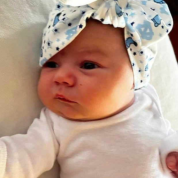 Kate is registered to the contest to win money with this photo: baby, baby_products, baby_sleeping, baby_toddler_clothing, beanie, cap, cheek, child, costume_hat, fashion_accessory, fun, happy, hat, headgear, pattern, pink, product, sleeve, textile, toddler