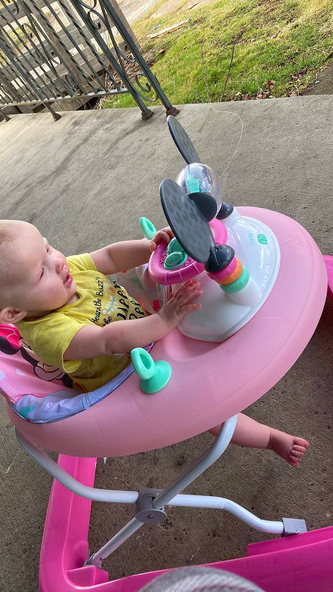 Bailey joined the competition — help win amazing prizes! baby, baby_products, baby_toddler_clothing, chair, child, fun, hat, human_leg, lap, leg, leisure, magenta, outdoor_furniture, person, pink, play, recreation, sandal, sitting, thigh