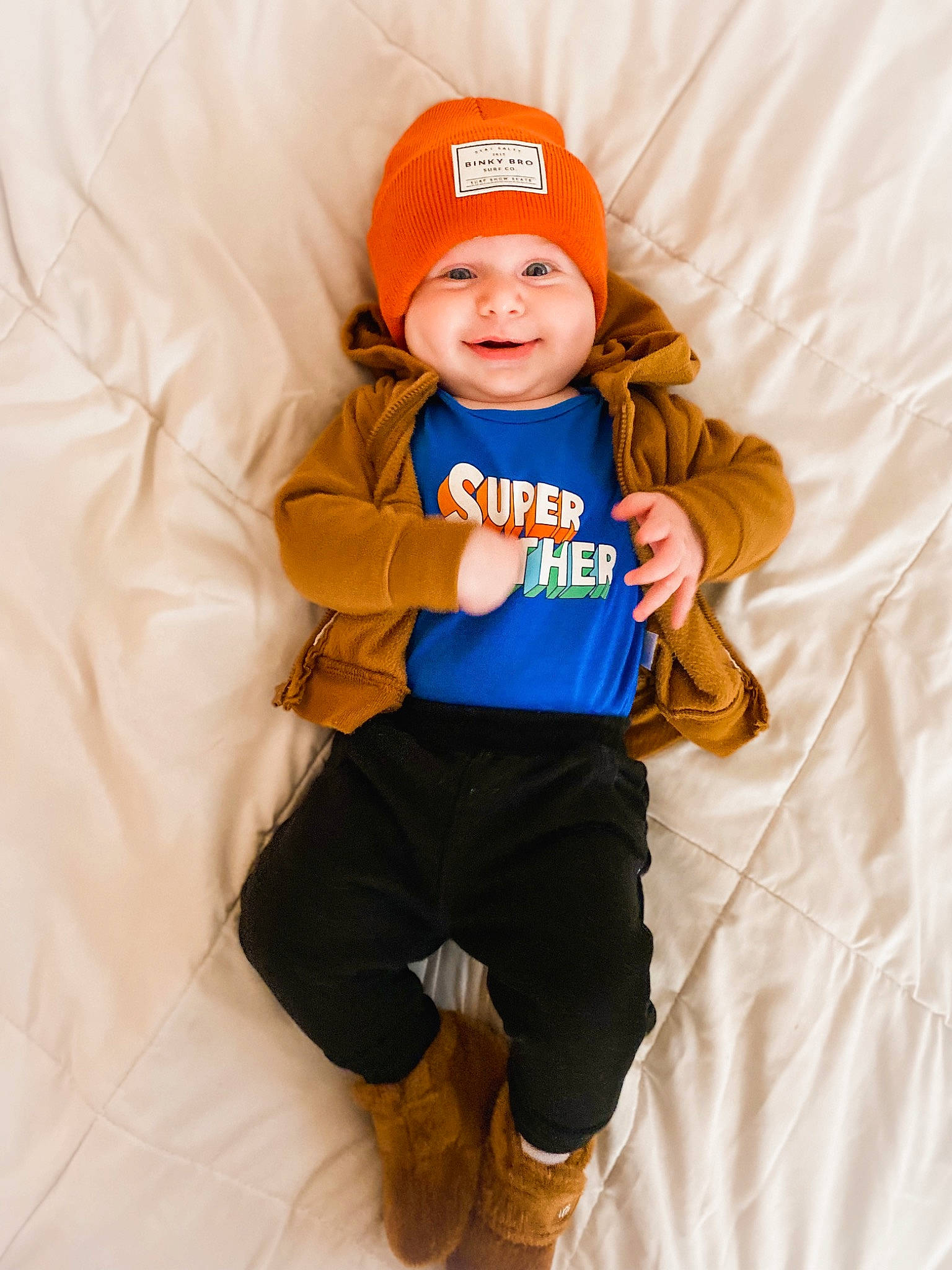 Zayden is registered to the contest to win money with this photo: baby, baby_toddler_clothing, baseball_cap, cap, child, comfort, electric_blue, face, finger, happy, headgear, headwear, leg, orange, person, personal_protective_equipment, sleeve, smile, sportswear, t_shirt