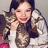Zelda a rejoint le concours — aidez-le/la à gagner de superbes lots ! animal, cat, child, comfort, cozy, cute, feline, friendship, girl, happy, holding, home, indoor, pajamas, pet, portrait, sleepy, smiling, tabby_cat, young