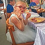 Zelda participe au concours pour gagner de l'argent avec cette photo : child, girl, boy, woman, party, table, food, snack, plate, bread, chair, glasses, dress, tulle, headband, smile, dining, indoor, celebration, bouquet