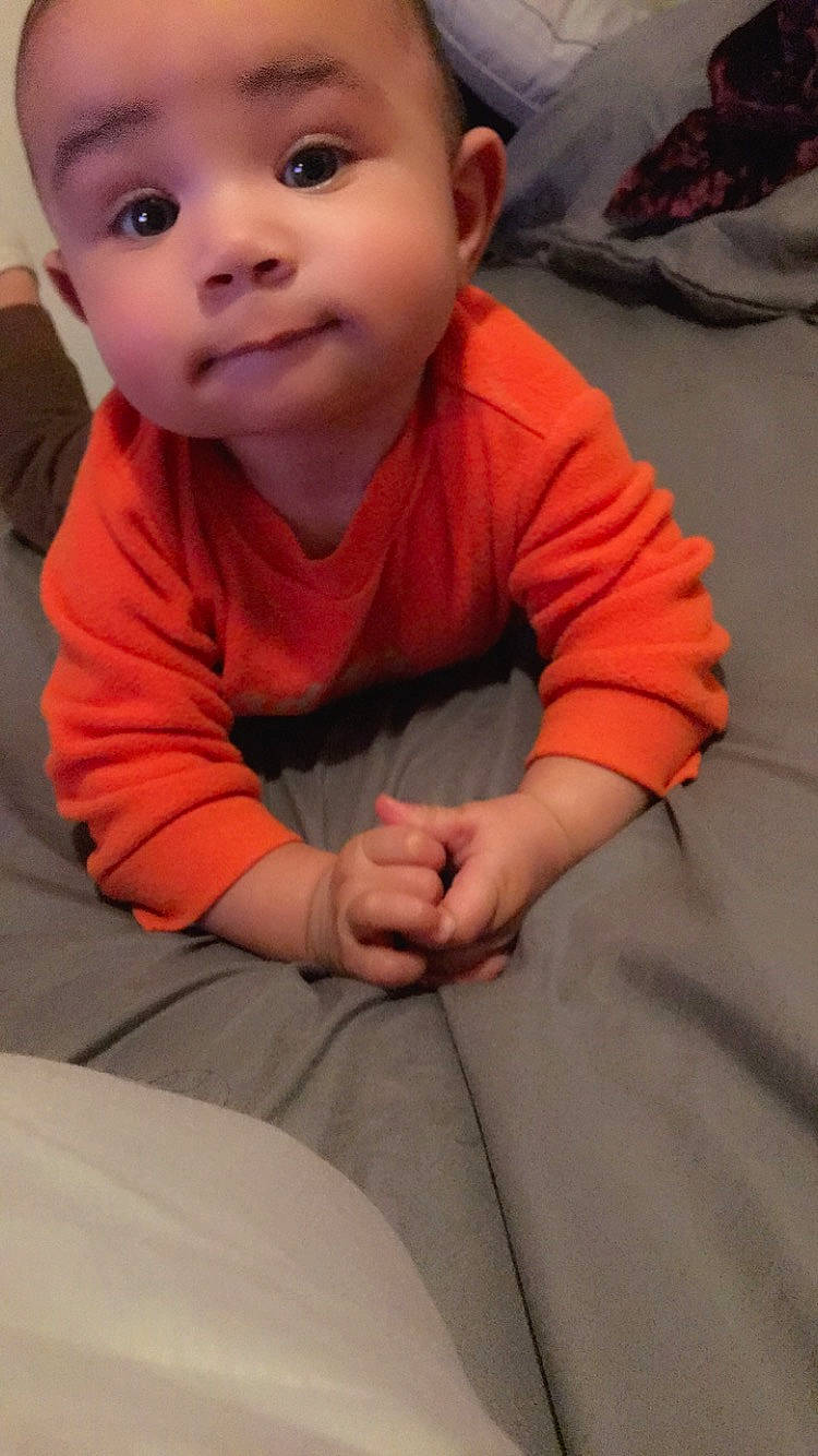 Dj is registered to the contest to win money with this photo: baby, baby_toddler_clothing, cheek, child, chin, comfort, eyebrow, finger, floor, flooring, fun, gesture, happy, mouth, nose, person, skin, sleeve, smile, thumb