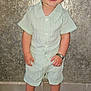 Swan participe au concours pour gagner de l'argent avec cette photo : toddler, child, smiling, standing, indoor, clothing, shorts, shirt, sandals, footwear, red_eye, bracelet, wall, tile_floor, person, cute, happy, young_child, fashion, portrait