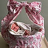 Maliah joined the competition — help win amazing prizes! baby, sleeping, knitted_clothing, basket, bow, pink, white, floral_pattern, fabric, soft_lighting, peaceful, newborn, portrait, indoors, decorative, cozy, cute, resting, infant, blanket