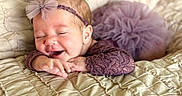 Maliah joined the competition — help win amazing prizes! baby, infant, smiling, headband, purple, lace, blanket, soft, quilted, sleepy, cute, child, newborn, happy, portrait, resting, hands, face, toddler, cozy