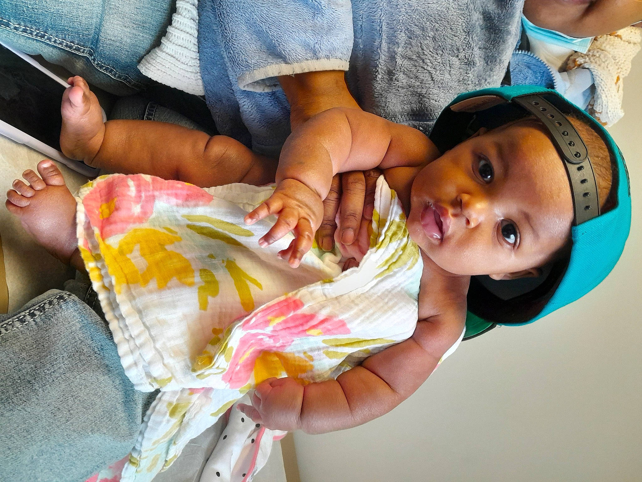 Amirah joined the competition — help win amazing prizes! baby, baby_toddler_clothing, child, dress, event, eyelash, fun, gesture, happy, hat, headwear, human_leg, leisure, nail, person, room, sitting, skin, thumb, toddler