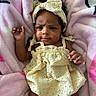Legaci Velazquez is registered to the contest to win money with this photo: baby, infant, child, blanket, pink, yellow_dress, headband, curly_hair, cute, portrait, indoors, soft_texture, fabric, happy, smiling, newborn, young_child, person, baby_clothes, lying_down