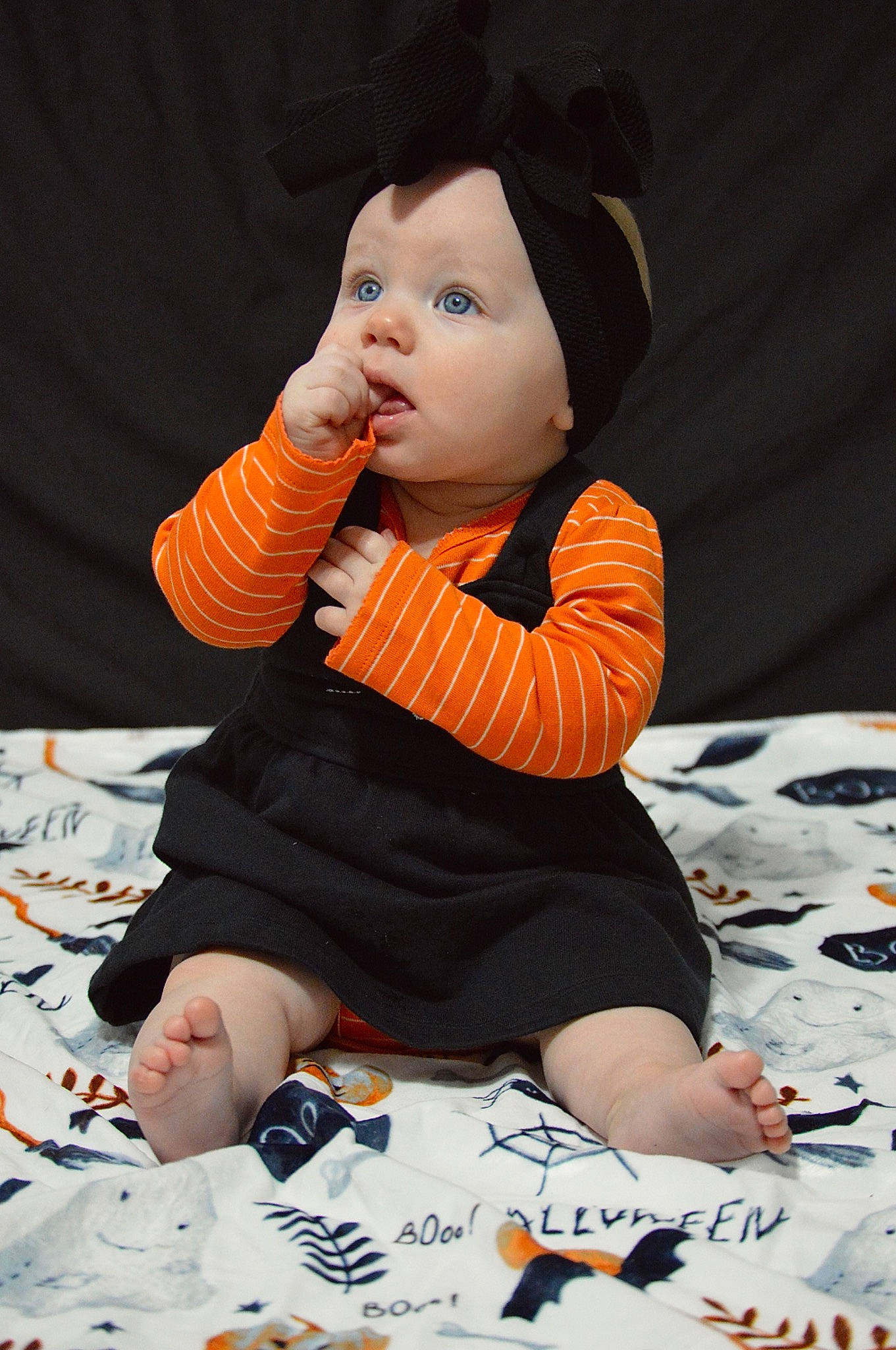 Kolbie is registered to the contest to win money with this photo: baby, baby_toddler_clothing, cheek, child, comfort, finger, flooring, fun, hand, happy, head, nail, orange, pattern, person, sitting, skin, sleeve, surprise, thumb