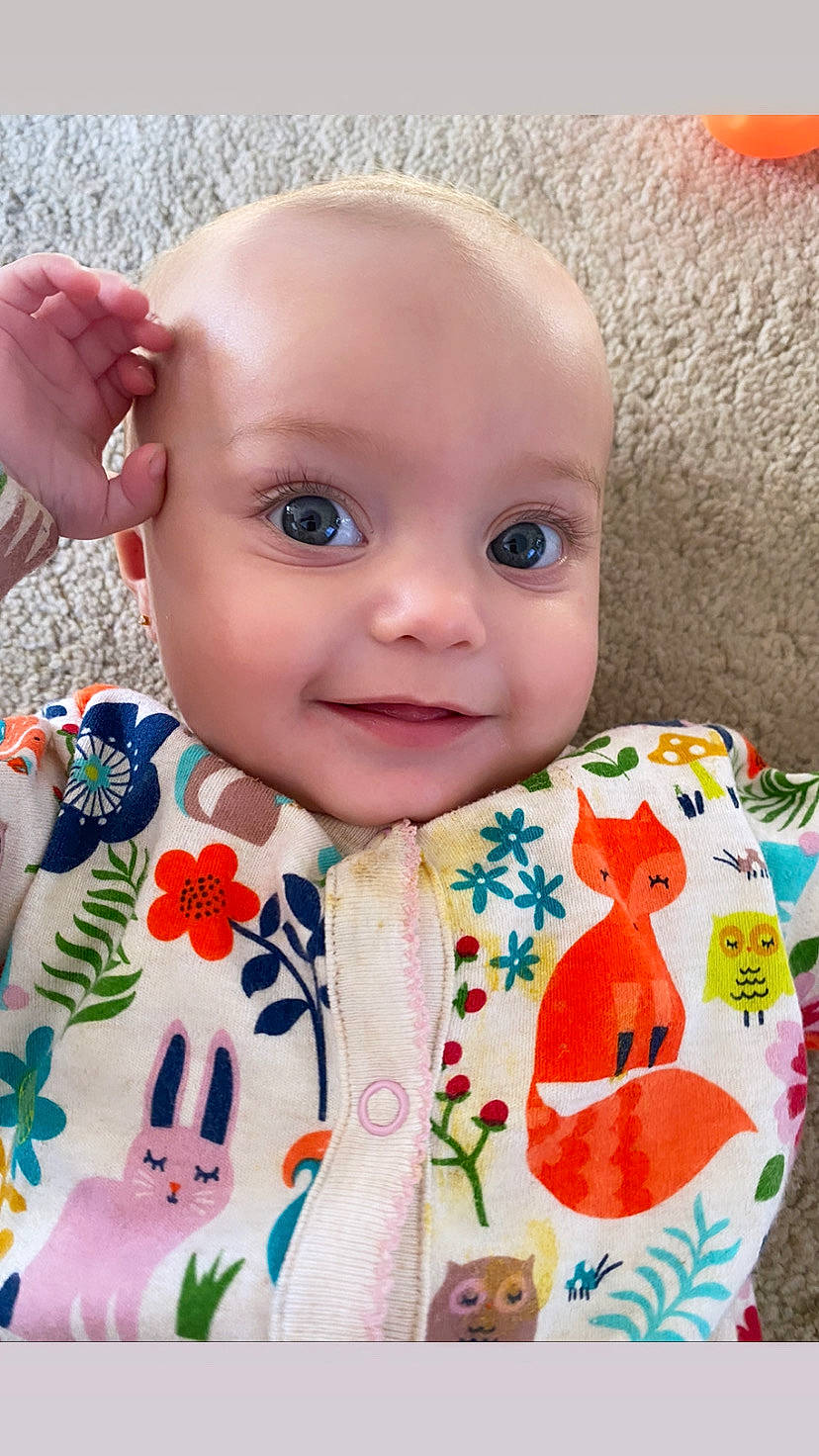 Rosalie joined the competition — help win amazing prizes! baby, baby_products, baby_toddler_clothing, cheek, child, chin, dress, eye, face, happy, iris, joy, lip, nose, person, pink, skin, sleeve, smile, t_shirt