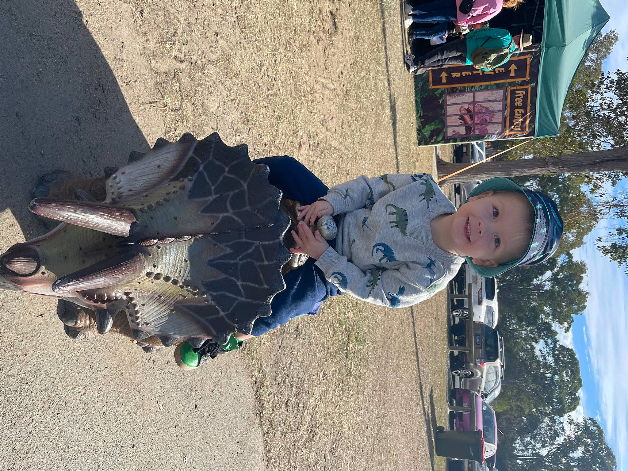 Archie is registered to the contest to win money with this photo: asphalt, child, city, concrete, cool, electric_blue, freezing, fun, headwear, joy, landscape, leisure, pedestrian, person, shadow, sky, soil, toddler, tourism, travel