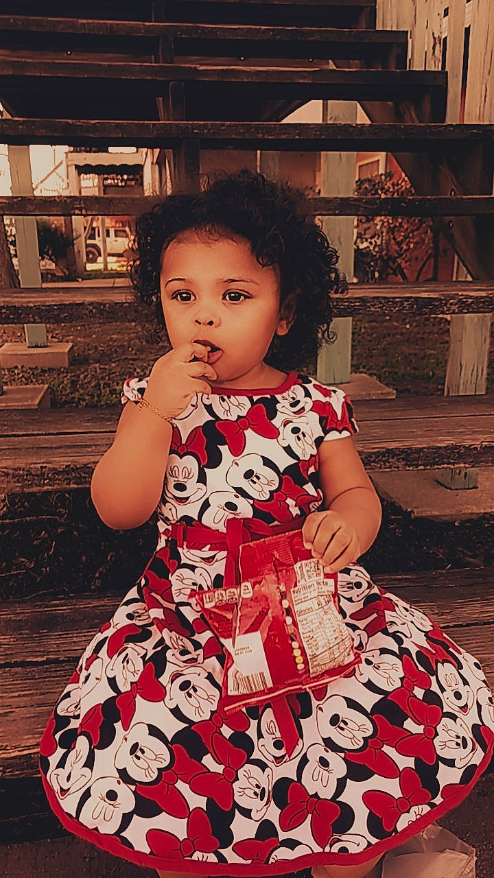 Aziza joined the competition — help win amazing prizes! baby_toddler_clothing, child, day_dress, dress, facial_expression, fashion_design, flash_photography, fun, happy, human_leg, magenta, one_piece_garment, pattern, person, sitting, skin, sleeve, tints_and_shades, toddler, vintage_clothing