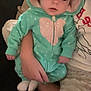 baby, blanket, child, comfort, cozy, cute, hand, hooded_onesie, indoor, infant, mint_green, person, polka_dots, portrait, relaxed, sitting, sleepwear, small, soft, warm