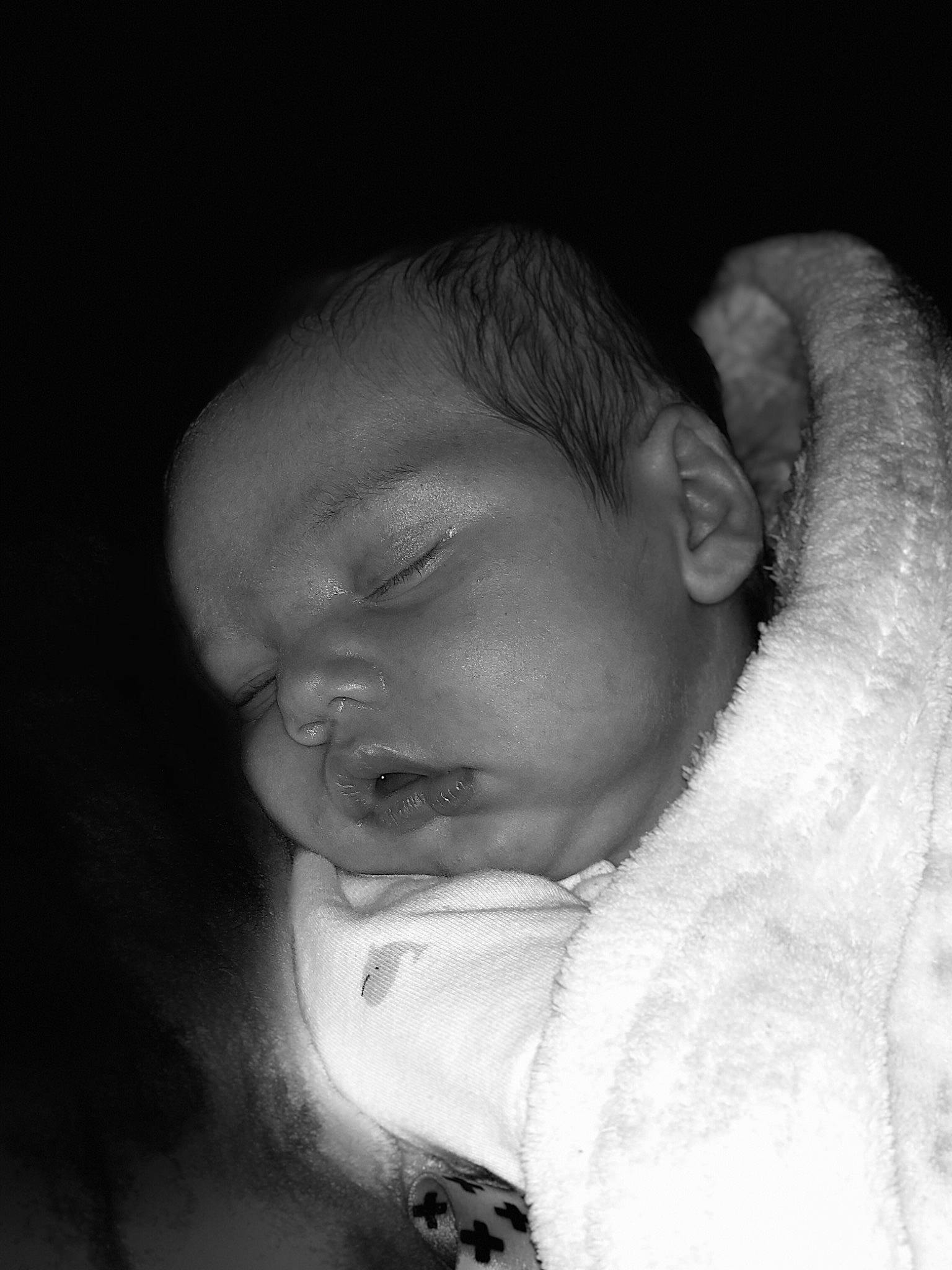 Luke is registered to the contest to win money with this photo: baby, black, black_and_white, cheek, child, chin, eye, face, forehead, head, lip, monochrome, monochrome_photography, mouth, nose, person, photograph, photography, skin, sleep