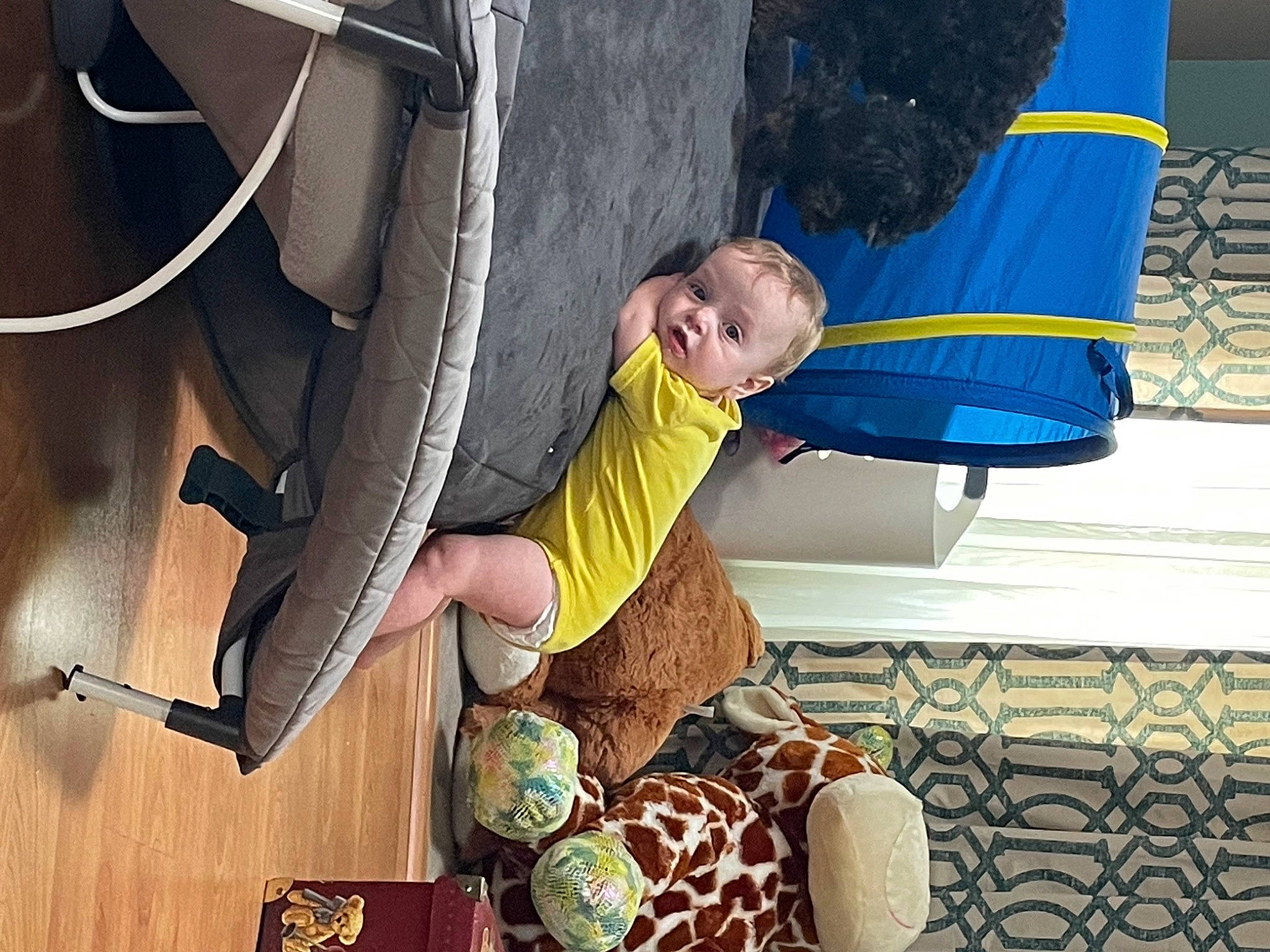 Asher is registered to the contest to win money with this photo: auto_part, automotive_tire, automotive_wheel_system, boats_and_boating_equipment_and_supplies, child, comfort, elbow, flooring, fun, leg, leisure, person, recreation, rope, smile, synthetic_rubber, t_shirt, tire, vehicle_door, wheel