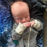 Sevyn joined the competition — help win amazing prizes! baby, sleeping, infant, striped_clothing, blanket, blue_blanket, cozy, cute, peaceful, hands, face, head, hair, newborn, soft_lighting, indoor, portrait, resting, child, toddler