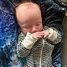 baby, sleeping, infant, striped_clothing, blanket, blue_blanket, cozy, cute, peaceful, hands, face, head, hair, newborn, soft_lighting, indoor, portrait, resting, child, toddler