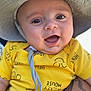 arm, baby, blue_sky, child, closeup, clothing, cute, daylight, expression, face, happy, hat, infant, mickey_mouse, outdoor, person, smiling, sunny, tattoo, yellow_shirt
