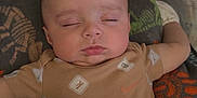 James joined the competition — help win amazing prizes! arm, baby, blanket, child, cozy, cute, fabric, face, head, indoors, infant, onesie, peaceful, pillow, resting, sleep, sleeping, soft_lighting, star_shaped_pillow, toddler