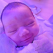 Alice joined the competition — help win amazing prizes! baby, infant, sleeping, smiling, face, head, mesh_blanket, soft_texture, purple_light, closeup, peaceful, newborn, skin, wrapped, portrait, indoors, cute, small, child, resting