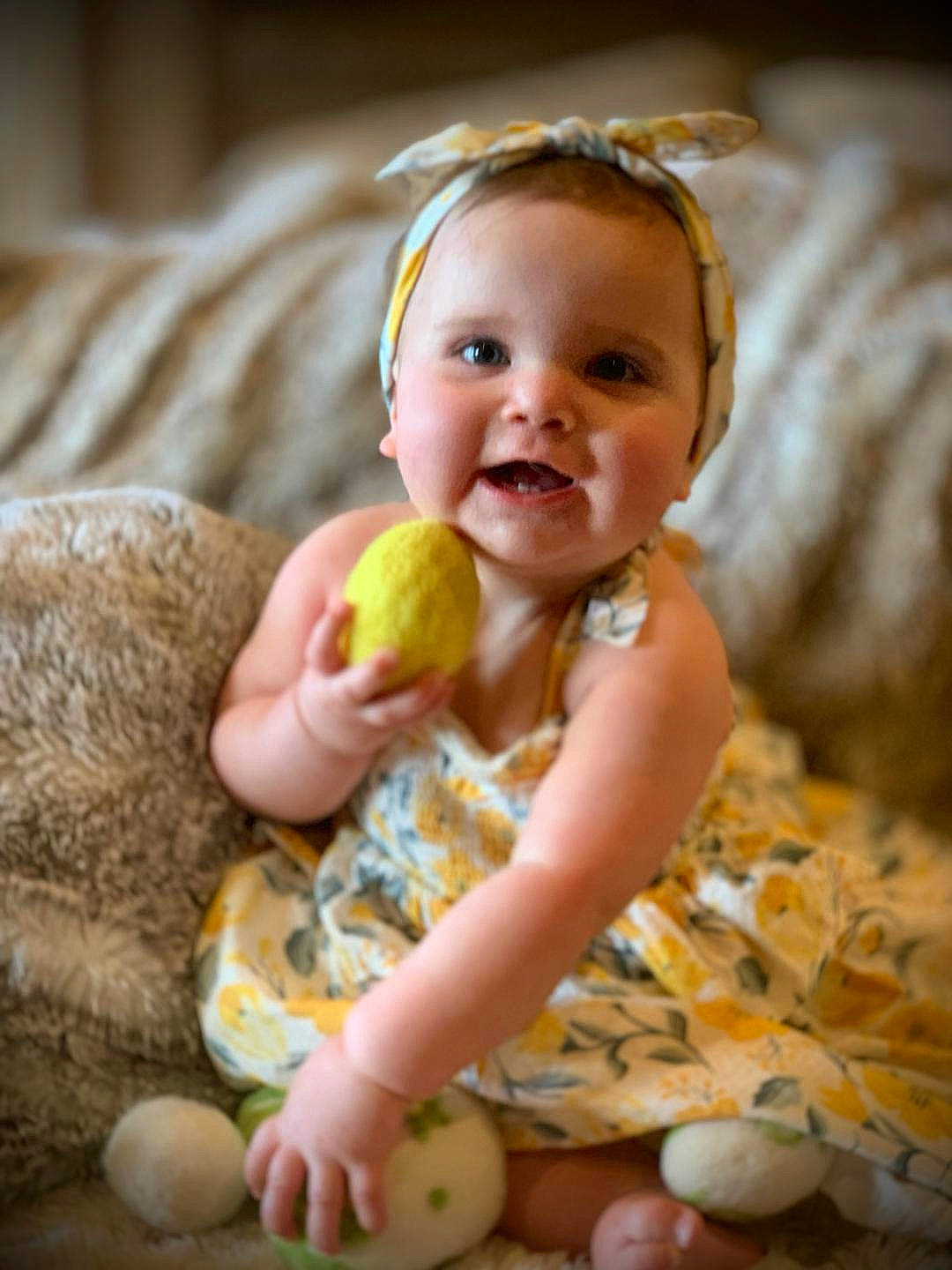 Lily is registered to the contest to win money with this photo: baby, baby_playing_with_toys, baby_toddler_clothing, beauty, cheek, child, comfort, finger, fun, happy, head, iris, joy, mammal, people_in_nature, person, sitting, skin, smile, toddler